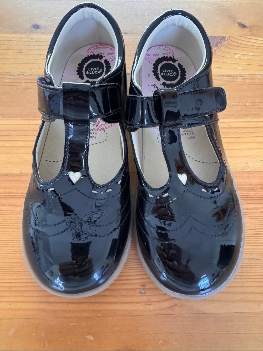 Livie & Luca Black Patent T-Strap Mary Janes with Heart Accent